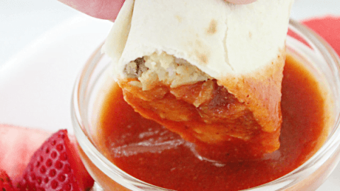 Breakfast Burritos with Homemade Taco Sauce @tableforseven #tableforsevenblog #breakfast #burrito #eggs #sausage #cheese #breakfastburrito