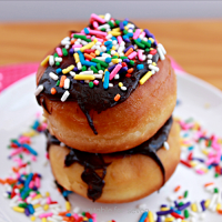 Chocolate Chip Cookie Dough Stuffed Doughnuts with Chocolate Glaze #doughnuts #donuts #chocolatechipcookiedough #stuffed #tableforsevenblog #chocolateglaze