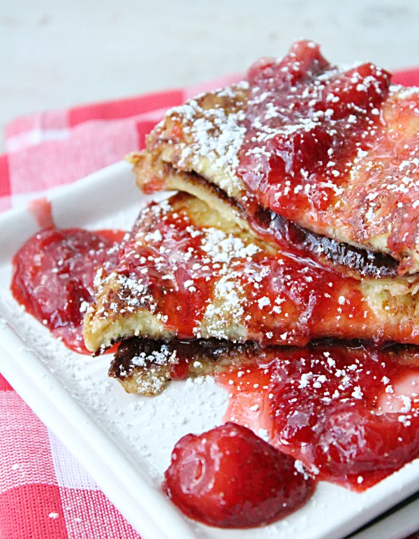 Chocolate Stuffed French Toast with Strawberry Syrup #chocolate #strawberry #syrup #tableforsevenblog @tableforseven #breakfast #frenchtoast