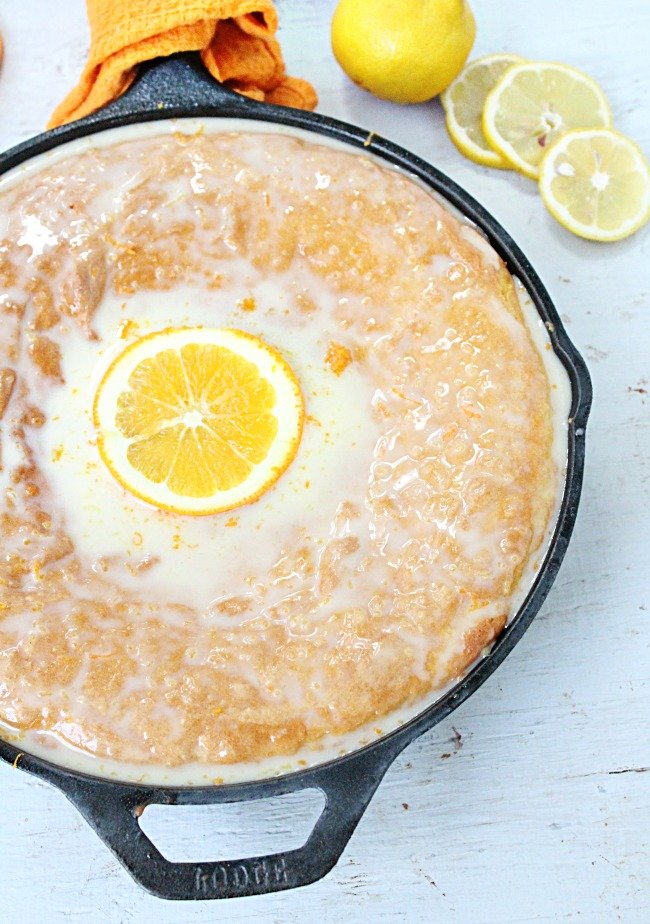 Iron Skillet Lemon Cake with Orange Glaze @tableforseven #tableforsevenblog #lemon #cake #orange #ironskillet #dessert 
