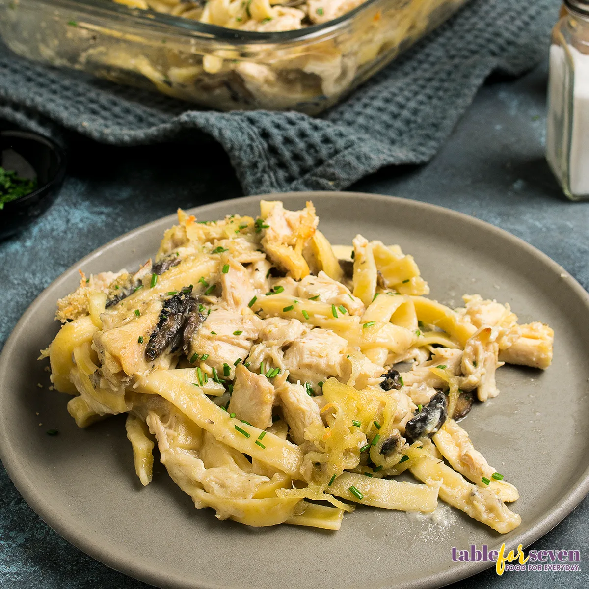 A serving of turkey tetrazzini plated and garnished with fresh herbs.