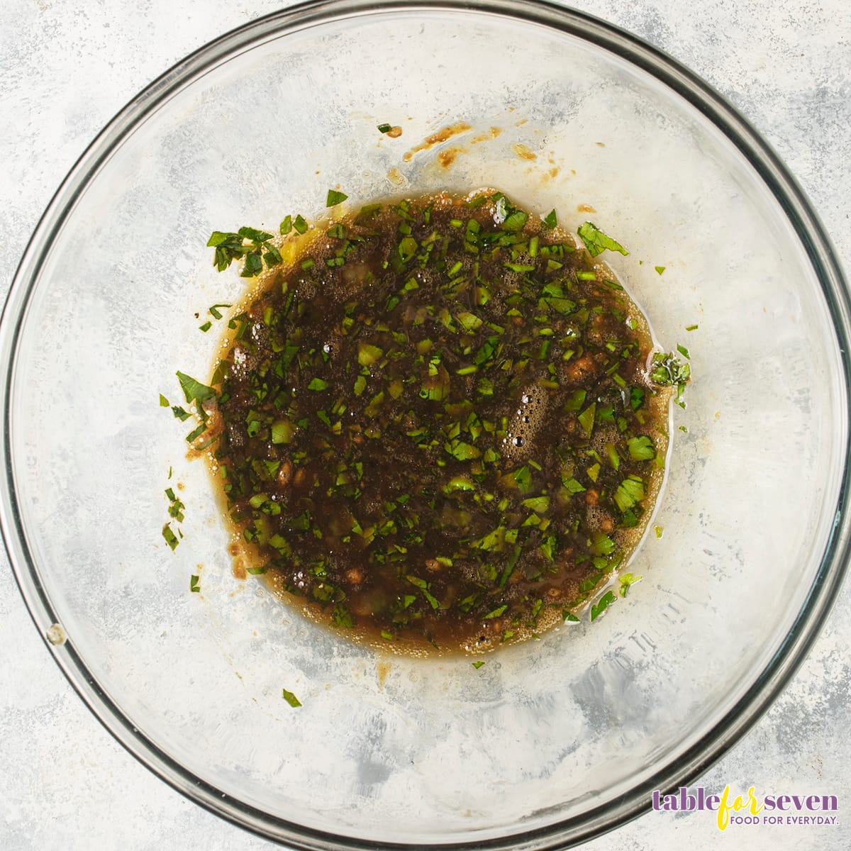 Herb and seasoning mix for turkey burger in a glass bowl