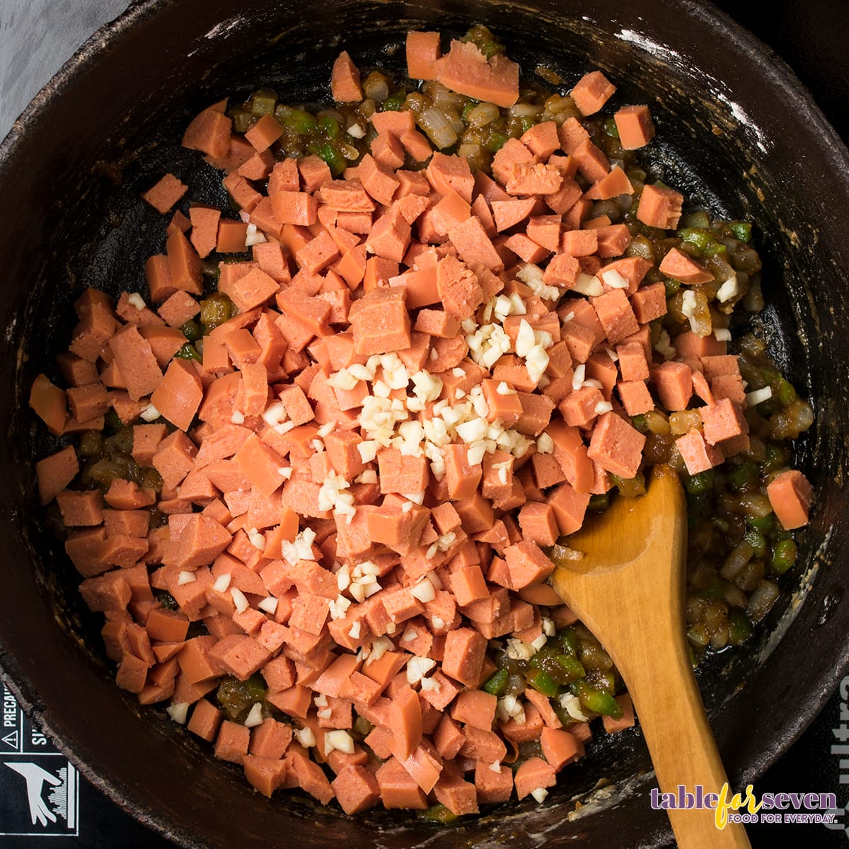 Cubed sausage added for gumbo preparation