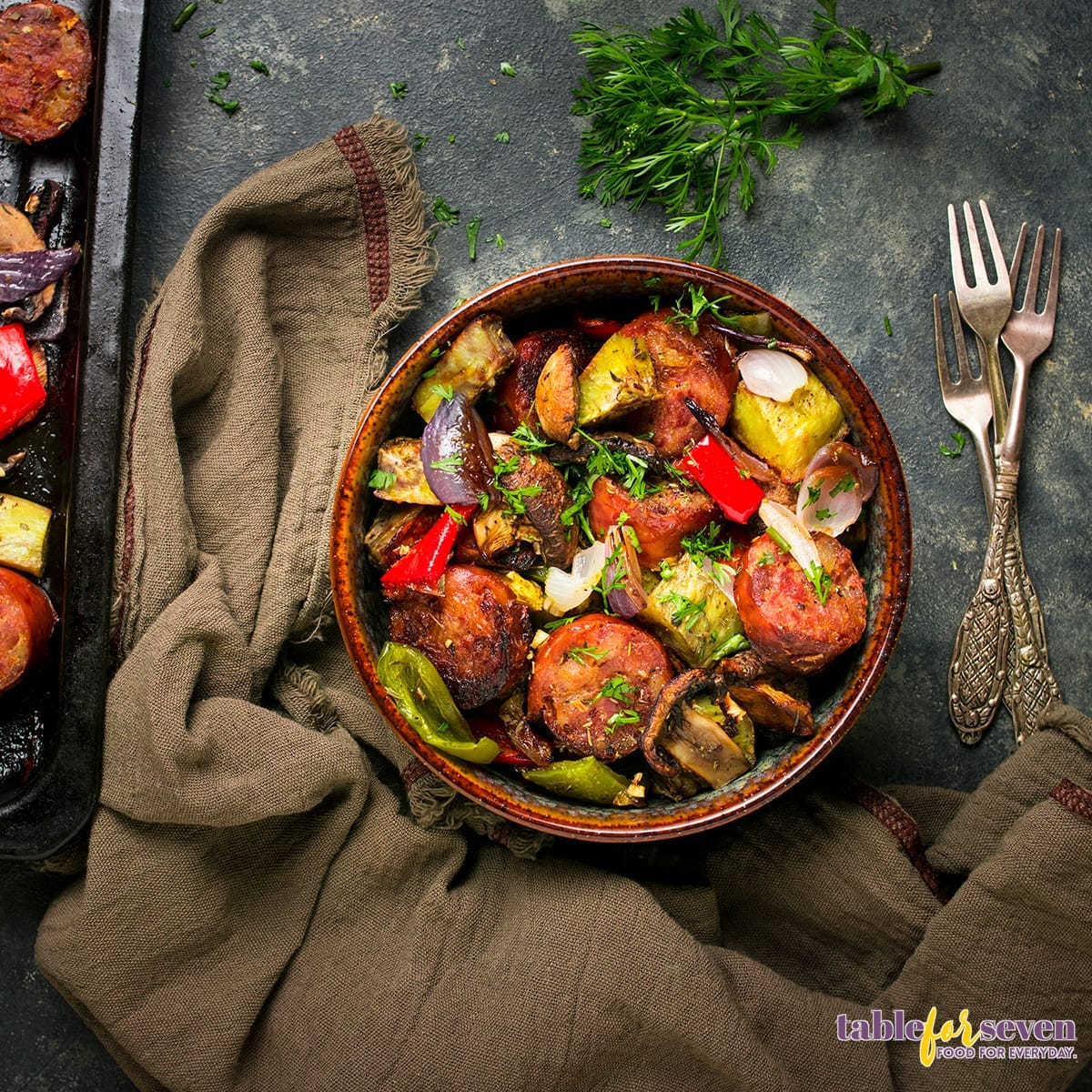  Top view of sausage and roasted vegetables in a bowl