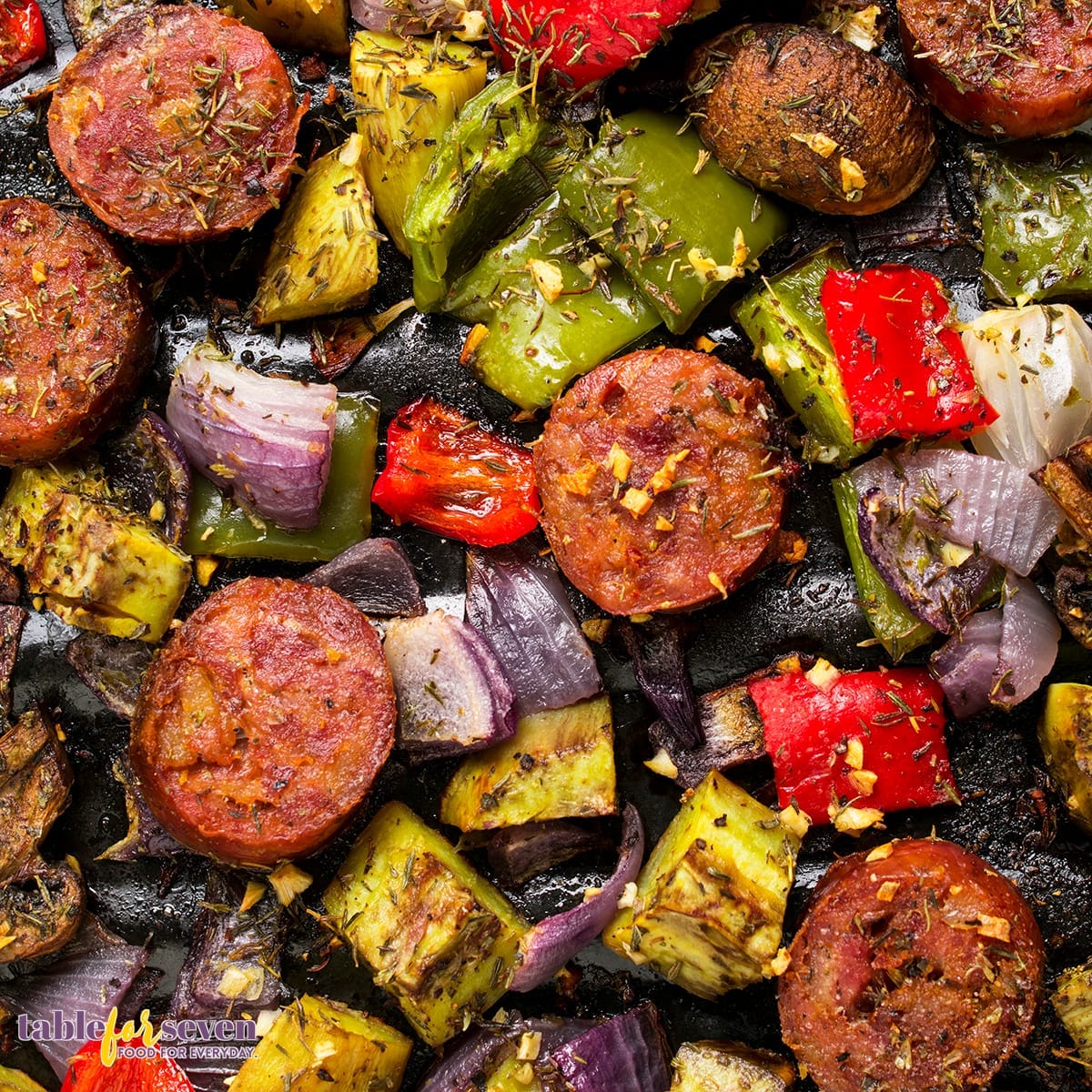 Detailed view of cooked sausage and roasted vegetables