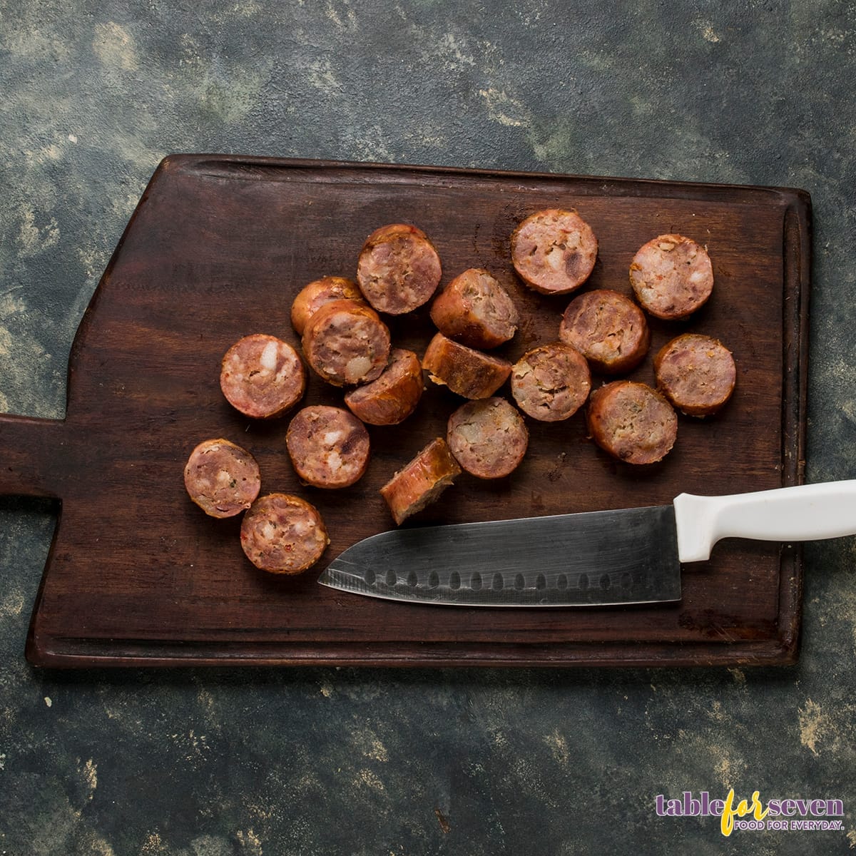 Close-up of seasoned sausage and vegetables in a bowl