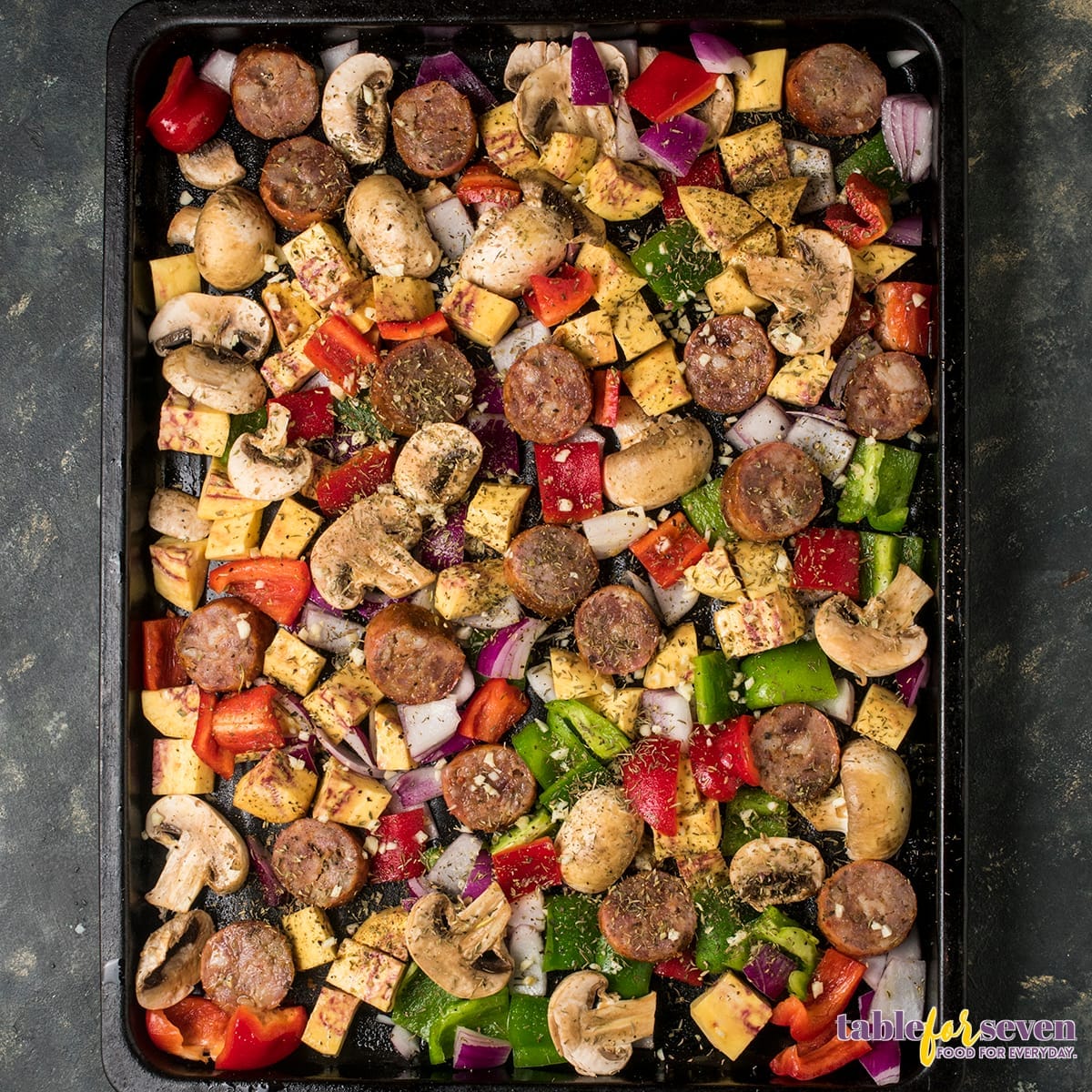 Seasoning vegetables and sausage for baking