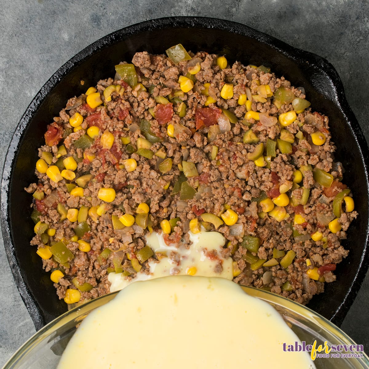 Adding cornmeal mixture to the tamale pie