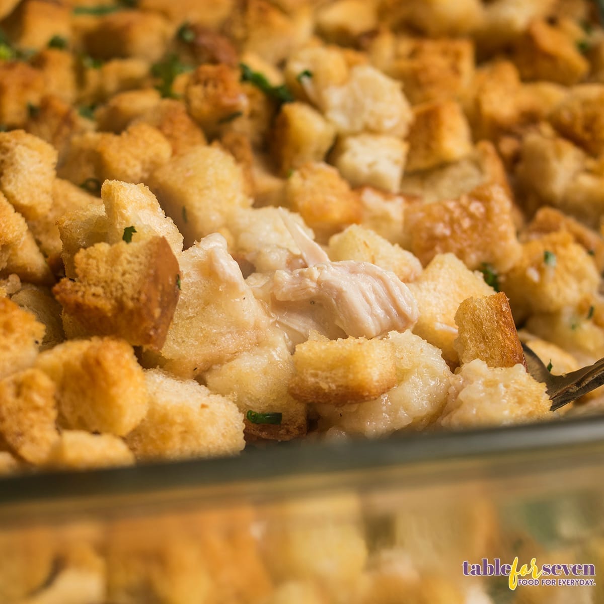 Close-up of the Pioneer Woman Chicken and Dressing Casserole dish with crispy bread topping