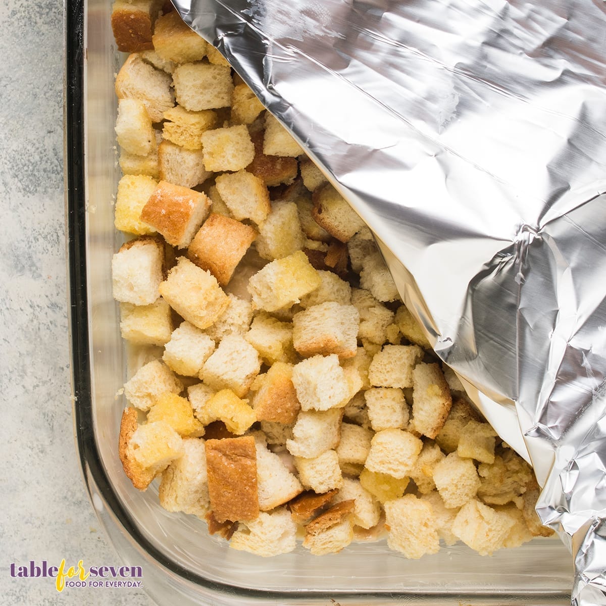 Covering the Pioneer Woman Chicken and Dressing Casserole with foil before baking