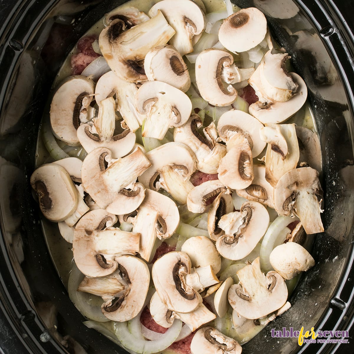 Fresh mushrooms sliced and ready for the Crock Pot Cube Steak