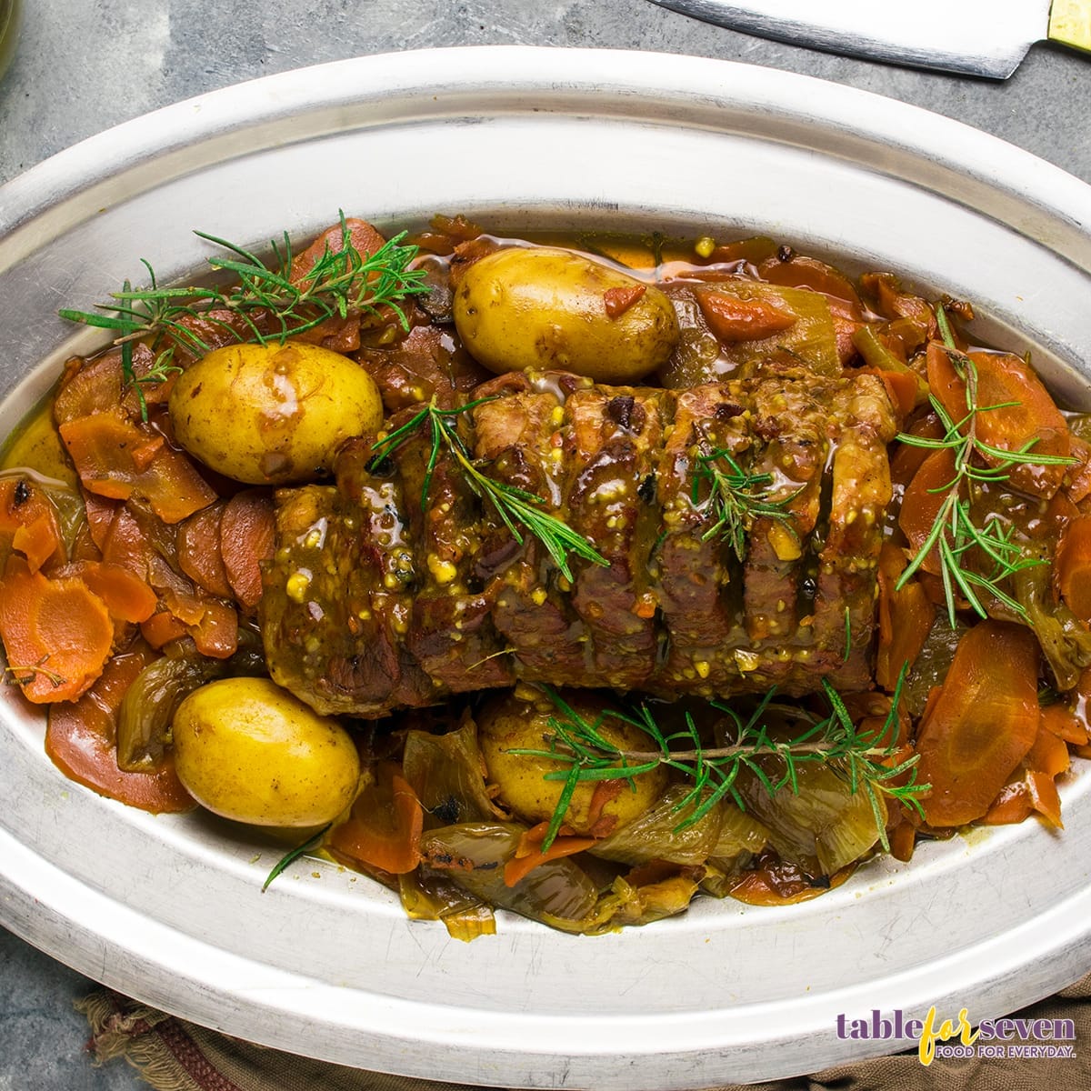 Rump roast topped with fresh rosemary