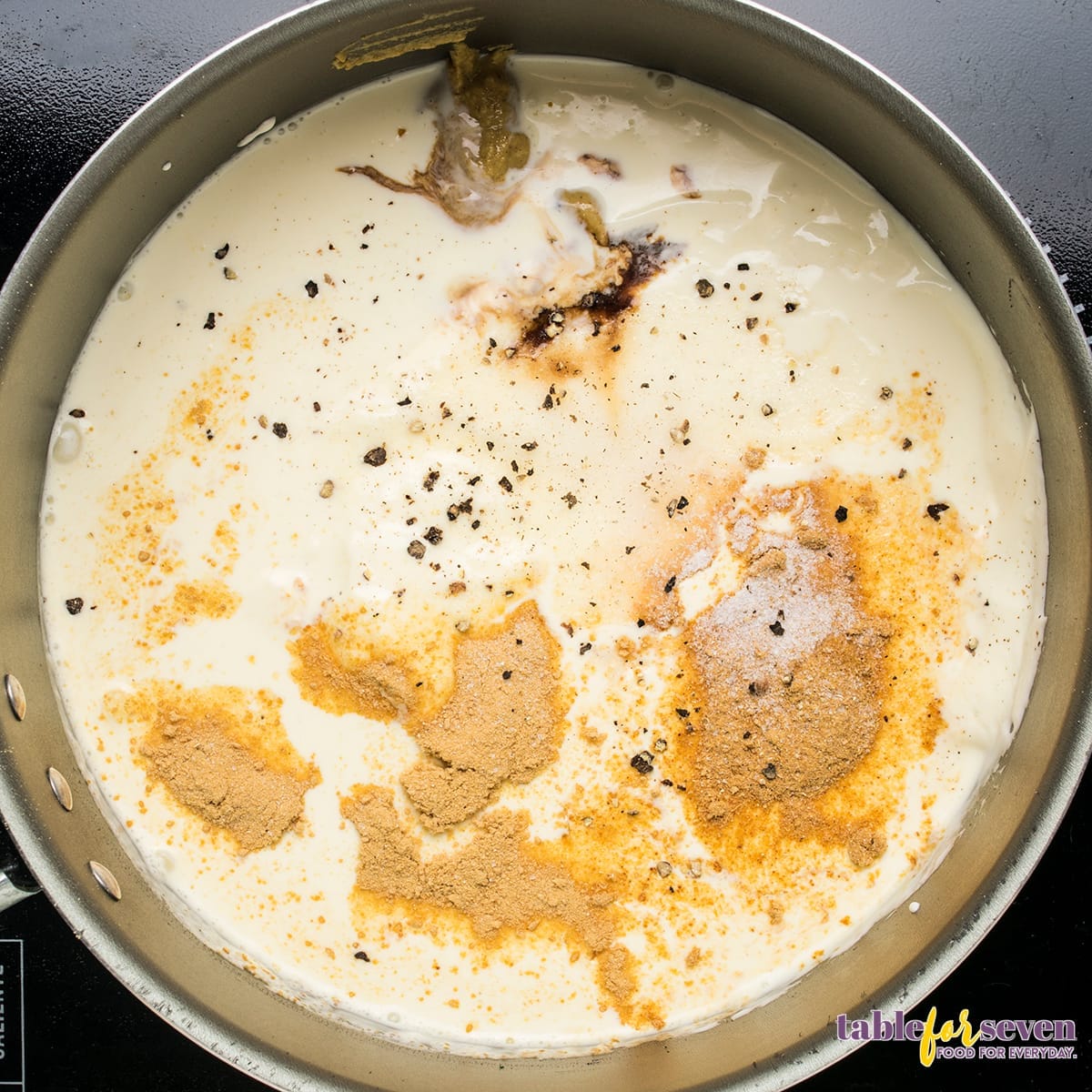 Cream mixture with spices being prepared for chicken divan