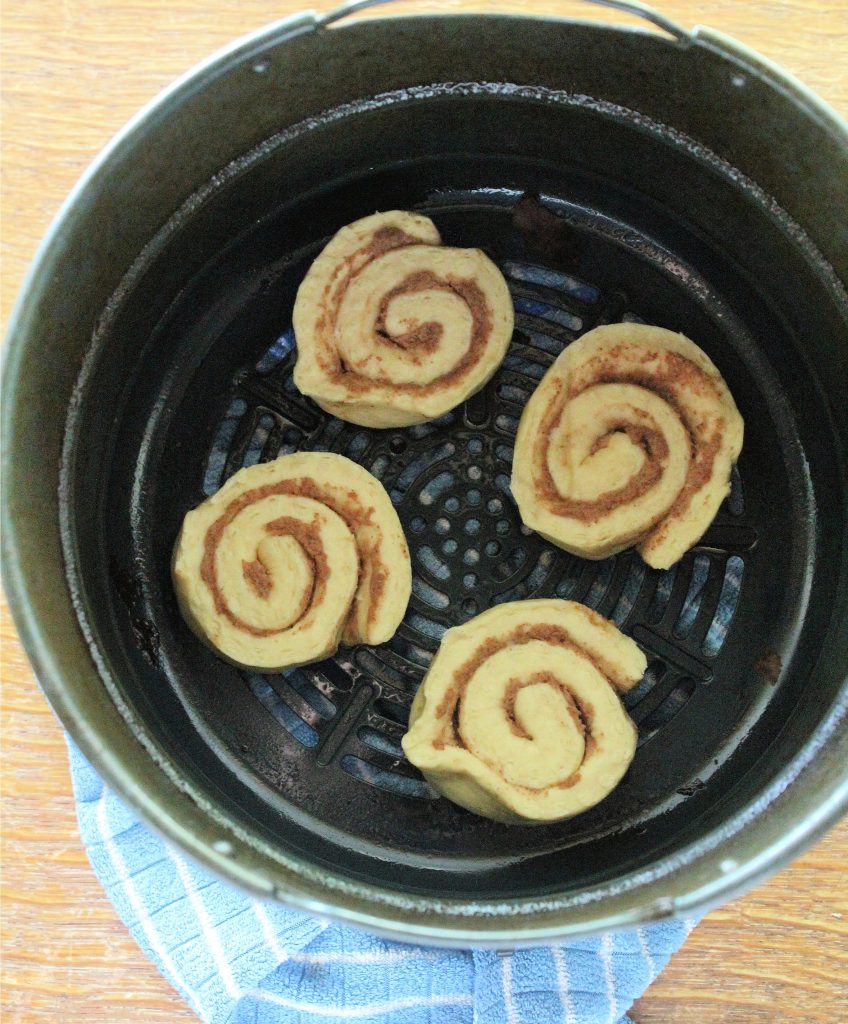Cinnamon Rolls in air fryer basket