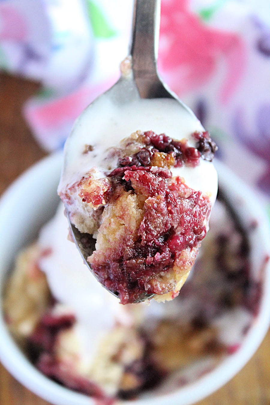 Crock Pot Mixed Berry Cobbler on a spoon