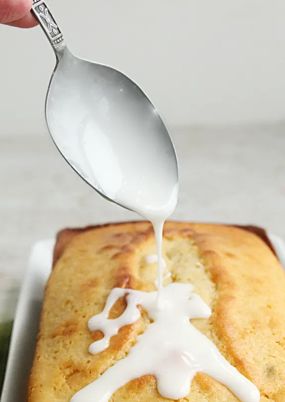 Buttermilk Pound Cake with Buttermilk Glaze pouring topping
