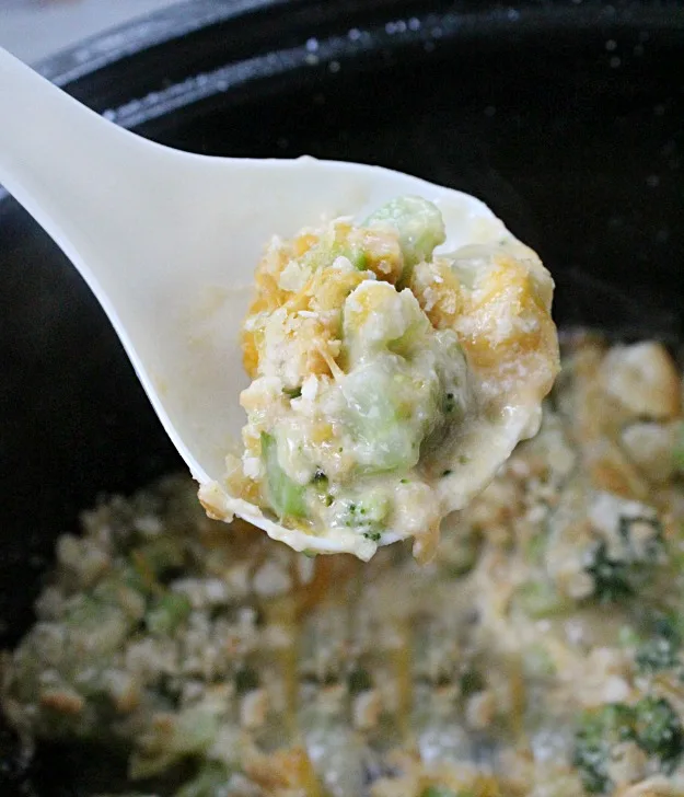 Crock Pot Broccoli and Cheese Casserole on a spoon