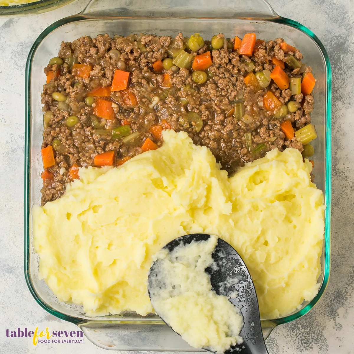 Mashed potatoes evenly over the meat mixture.