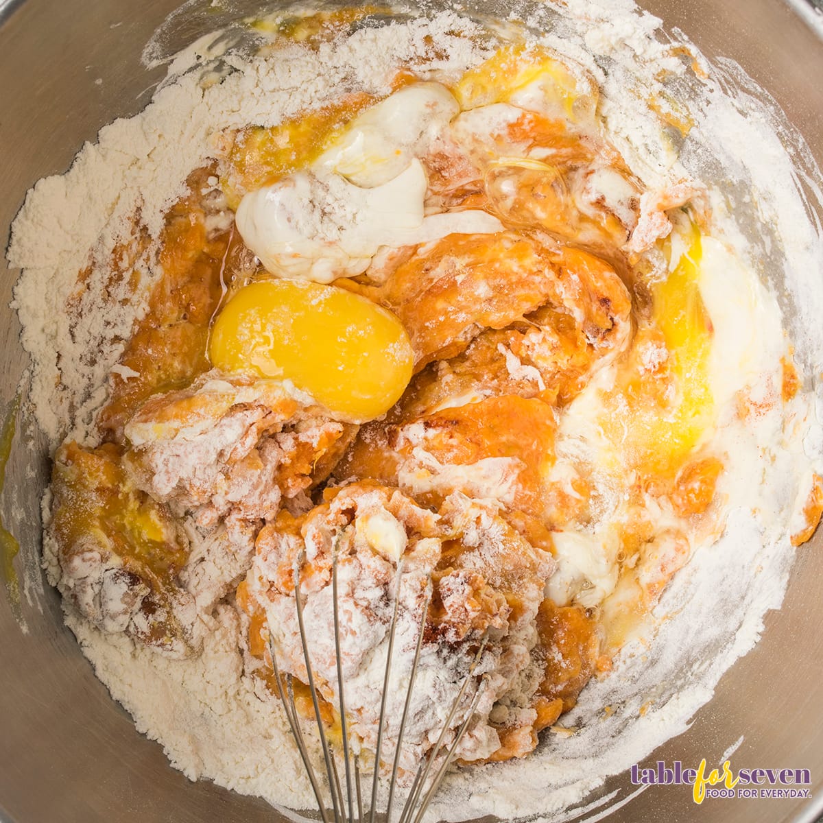 Process of mixing sweet potato jack ingredients in a stainless steel bowl