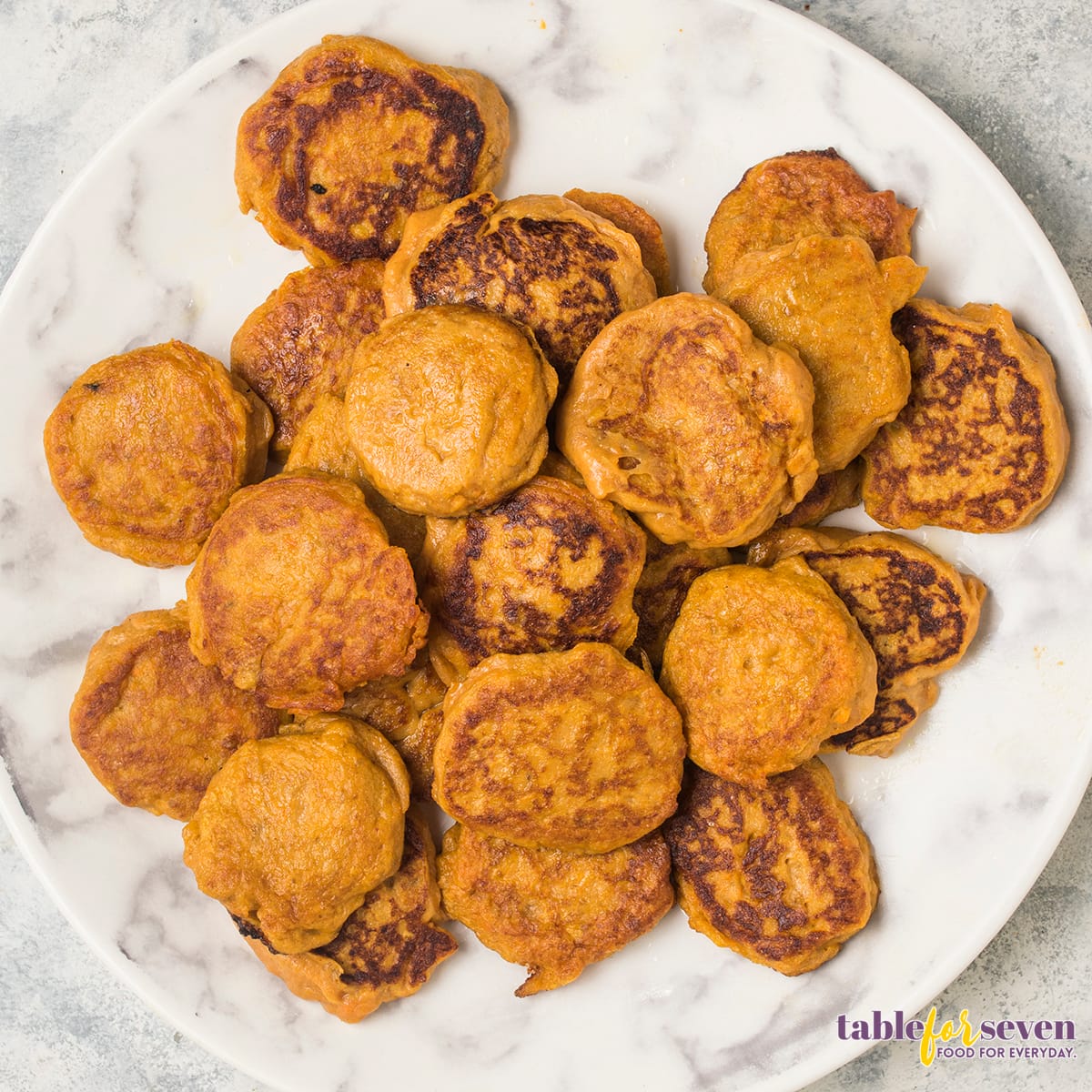 Sweet potato jack patties cooked and piled on a plate