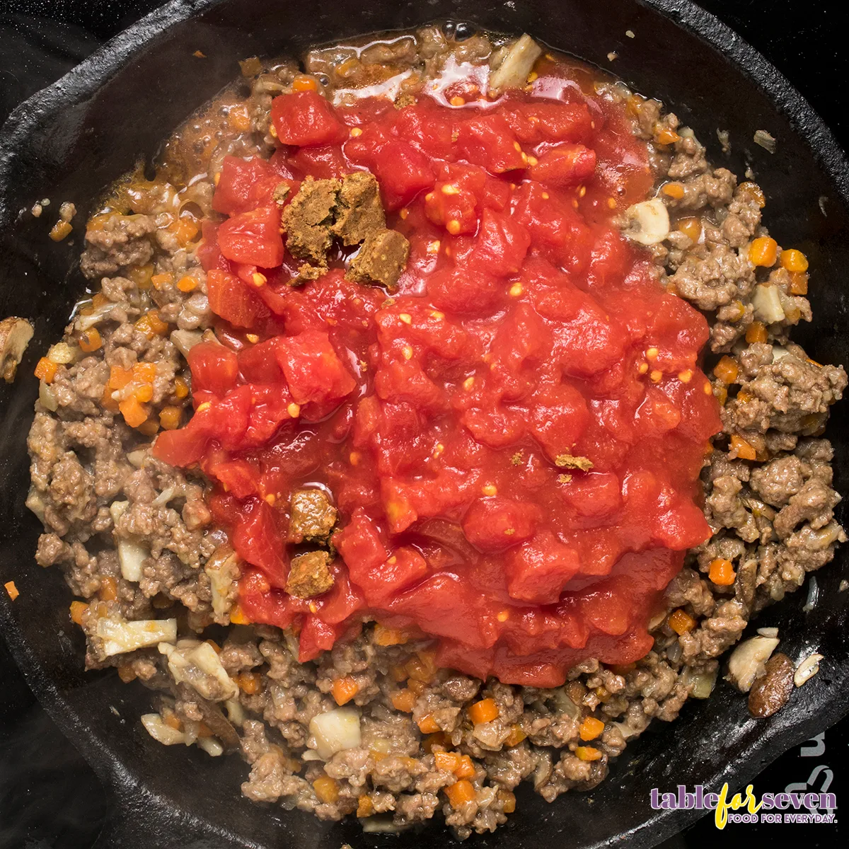 Diced tomatoes added to the ground beef mixture for Cottage Pie