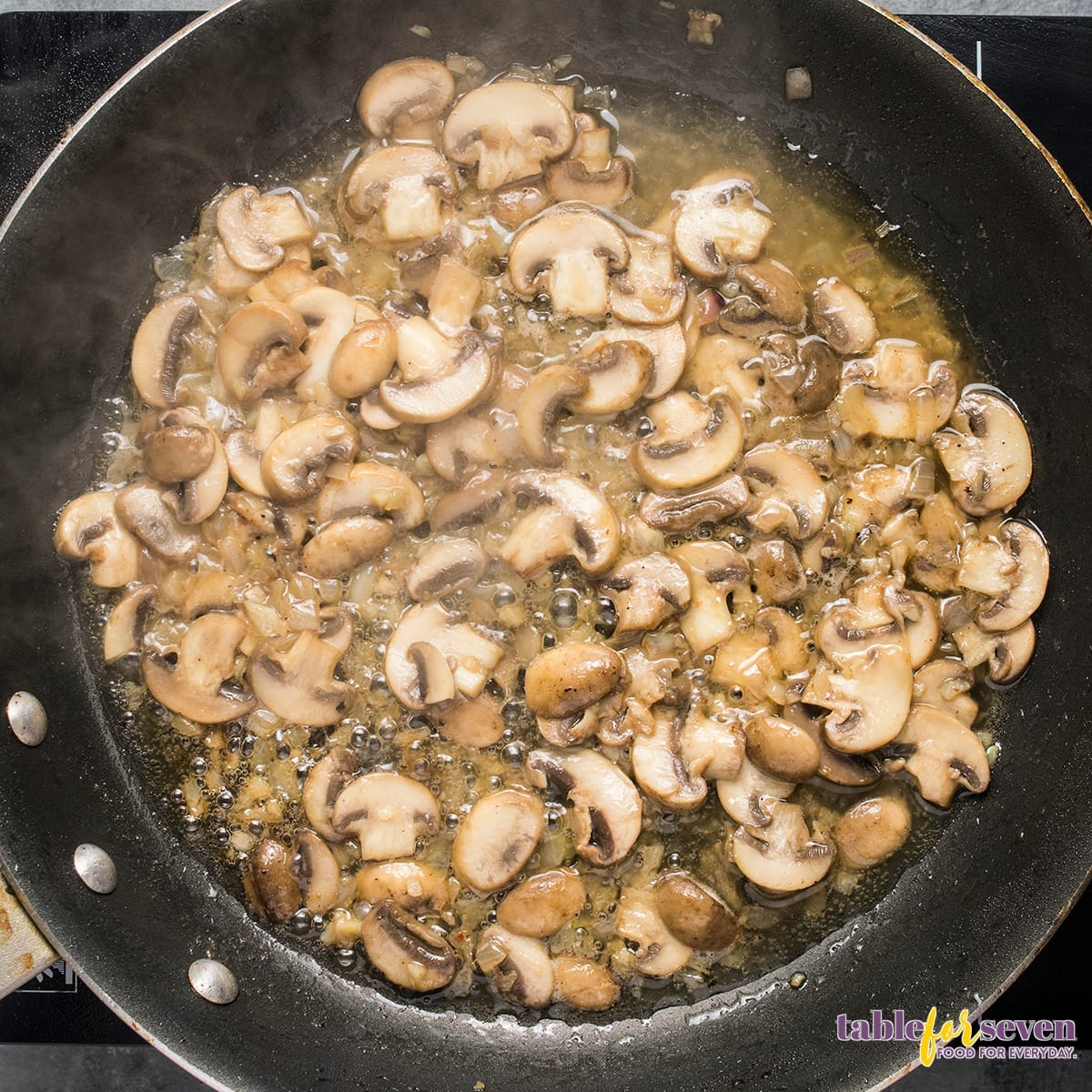 Sautéing mushrooms in a skillet