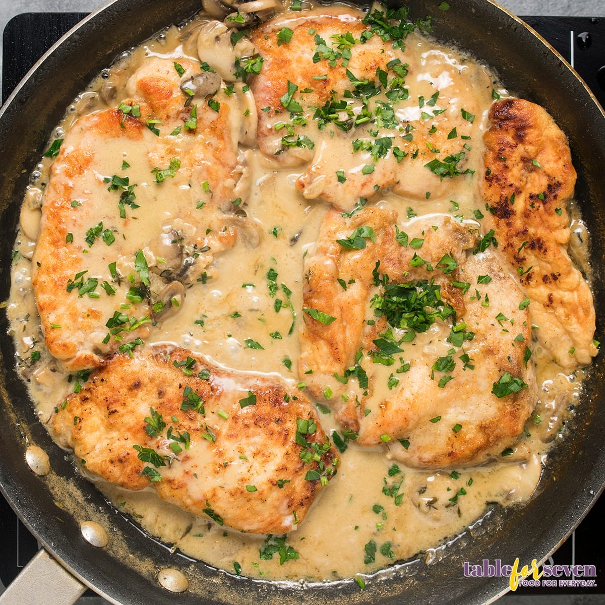 Marsala chicken garnished with fresh parsley