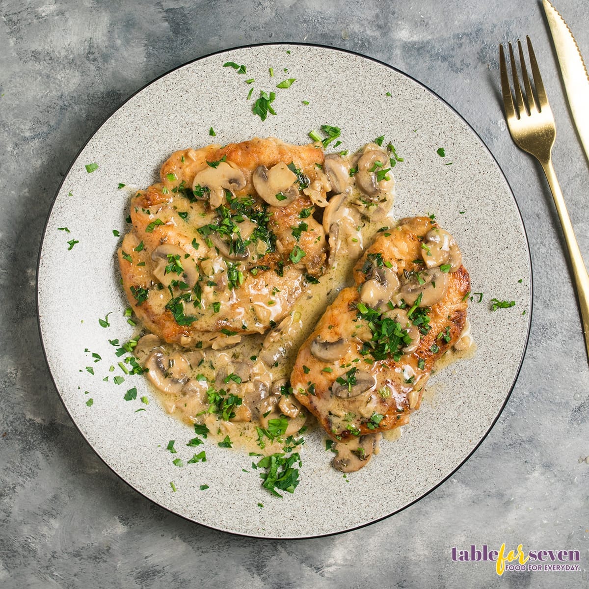 Marsala chicken served on a plate with mushrooms and sauce