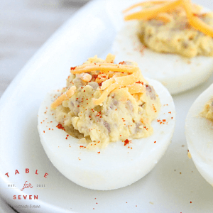 Sausage and Cheddar Deviled Eggs #deviledeggs #sausage #cheese #tableforsevenblog