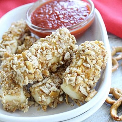 Baked Pretzel Crusted Mozzarella Sticks #pretzel #mozzarella #stringcheese #cheese #cheesesticks #tableforsevenblog
