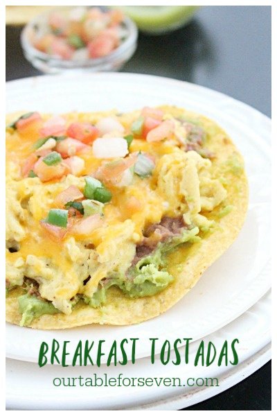 Breakfast Tostadas #tostada #breakfast #eggs #guacamole #tomatoes #cheese #tableforsevenblog 