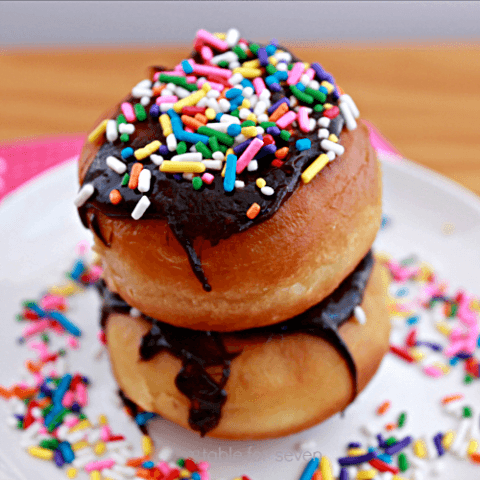 Chocolate Chip Cookie Dough Stuffed Doughnuts with Chocolate Glaze #doughnuts #donuts #chocolatechipcookiedough #stuffed #tableforsevenblog #chocolateglaze